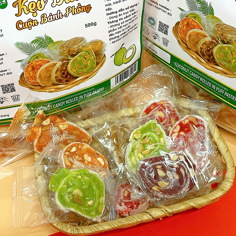 25875_z6125813347626-43a1f885918867730cdf9ca5875b4f3f_20241214151018-4.jpg Kẹo Dừa Cuộn Bánh Tráng Mix 7 Vị Thơm Ngon - Túi Zip 500g - KDCNP500