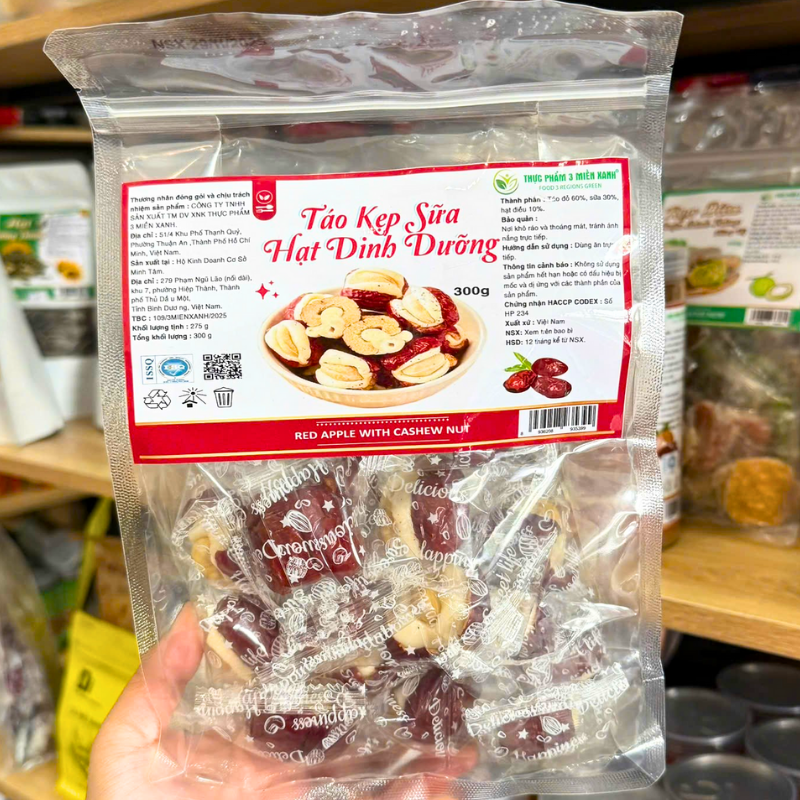 25878_55_20251204175119-3.png Táo Đỏ Kẹp Hạt Điều Túi Zip 300g - TDKHDTZ300